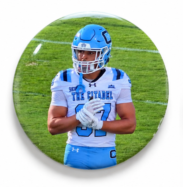 Picture Perfect round photo spirit button featuring a football player in a blue helmet and white jersey, without rhinestones or feathers.

