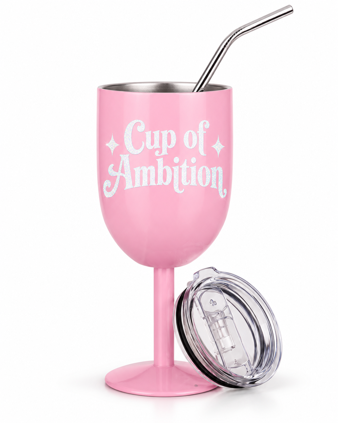 A pink wine glass-shaped insulated tumbler with a stainless steel straw, printed with the phrase 'Cup of Ambition' in white script. A clear lid with a black rim is placed beside it on a clean white background.
