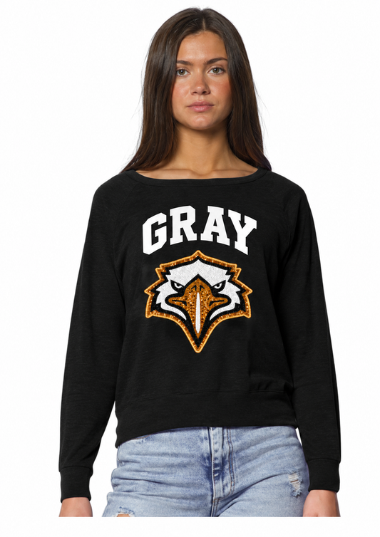 Woman wearing black Gray Eagle Energy Sequin Ladies Pullover with white GRAY lettering and black, white and gold sequin eagle head