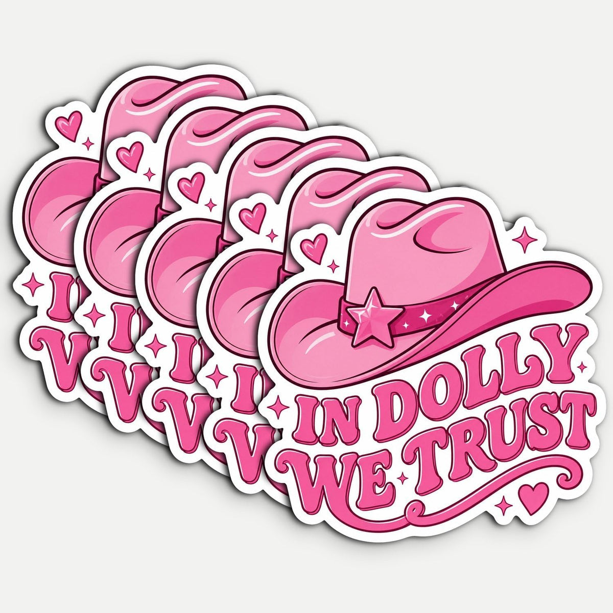A set of five pink cartoon cowboy hat stickers with the text 'I V V I IN DOLLY WE TRUST' in pink lettering, arranged diagonally on a light gray background.
